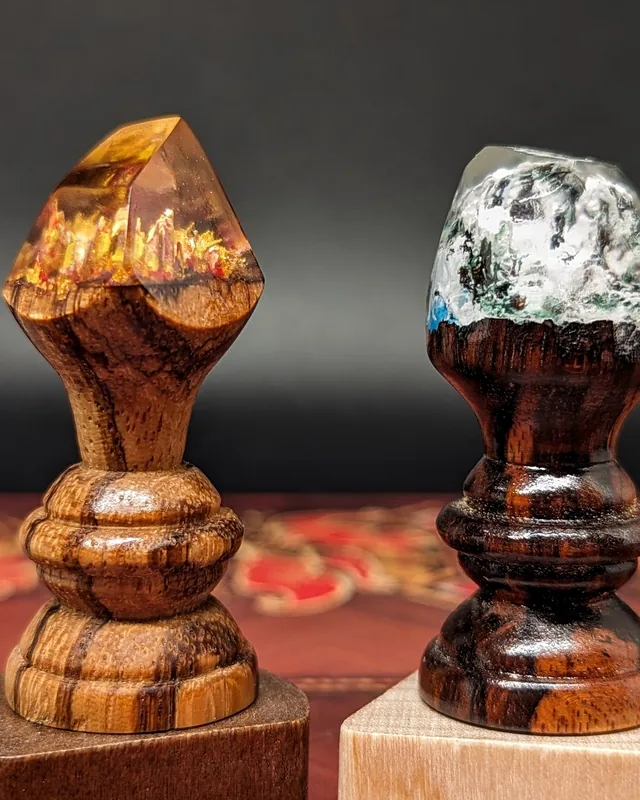 Two turned hardwood capstones topped with cast resin gems